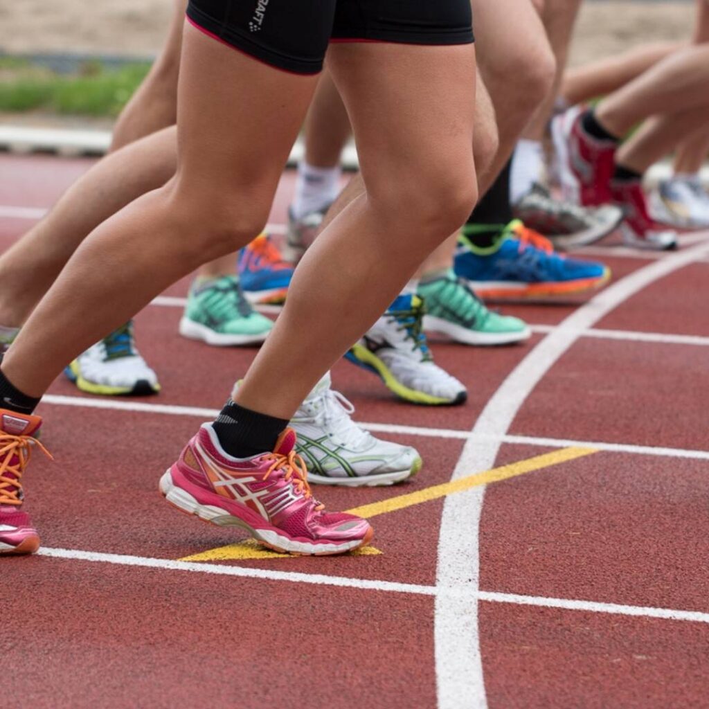 Legs of participants in a run/walk at the starting line