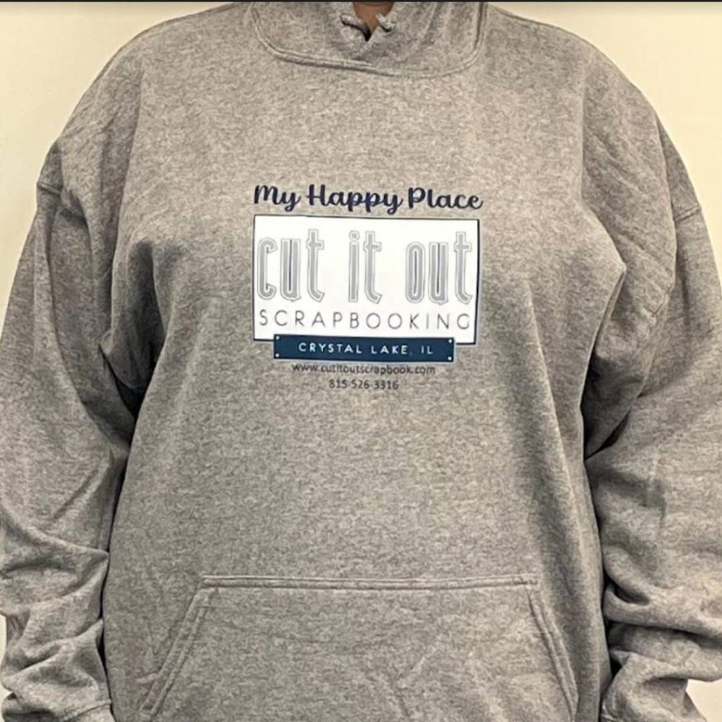A hoodie with the Cut it Out logo saying, My Happy Place