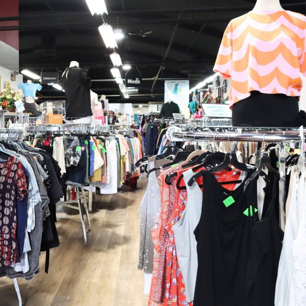 Clothing racks inside On Angel's Wings resale store